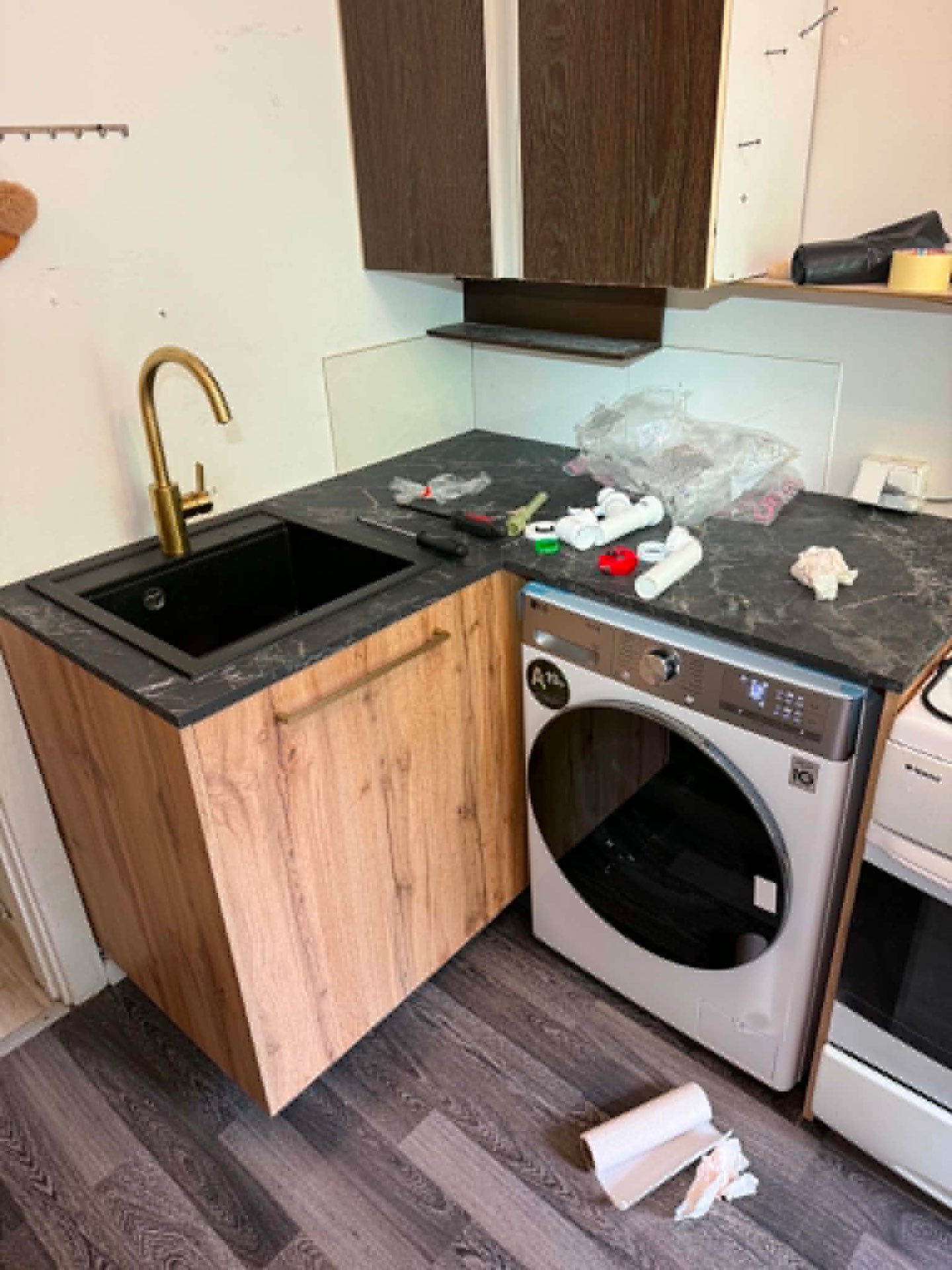 Kitchen cabinets, faucet & washer install — after