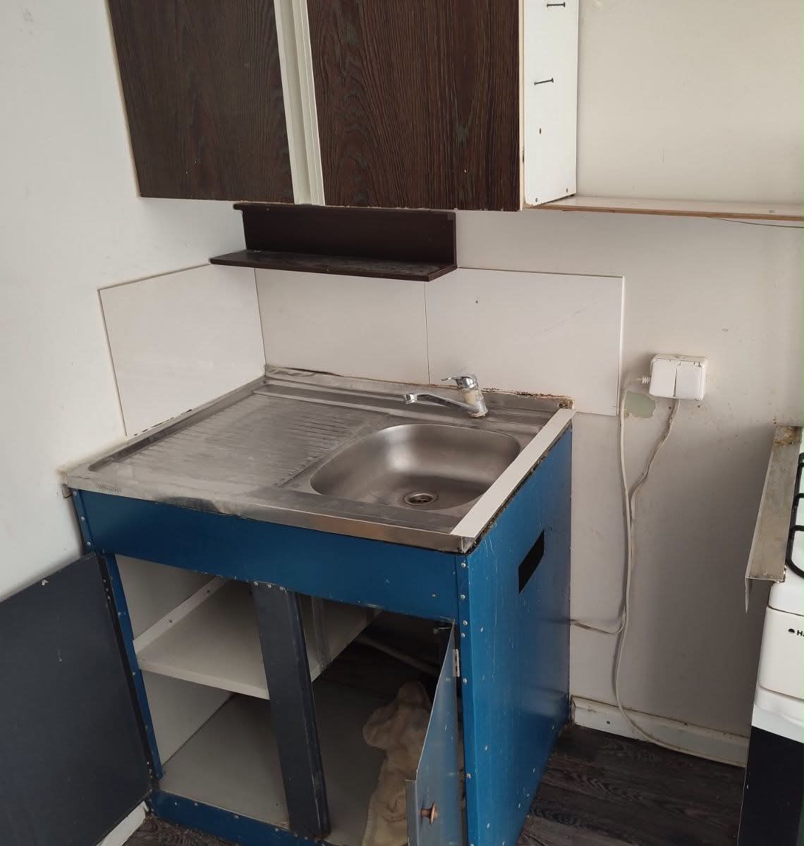 Kitchen cabinets, faucet & washer install — before