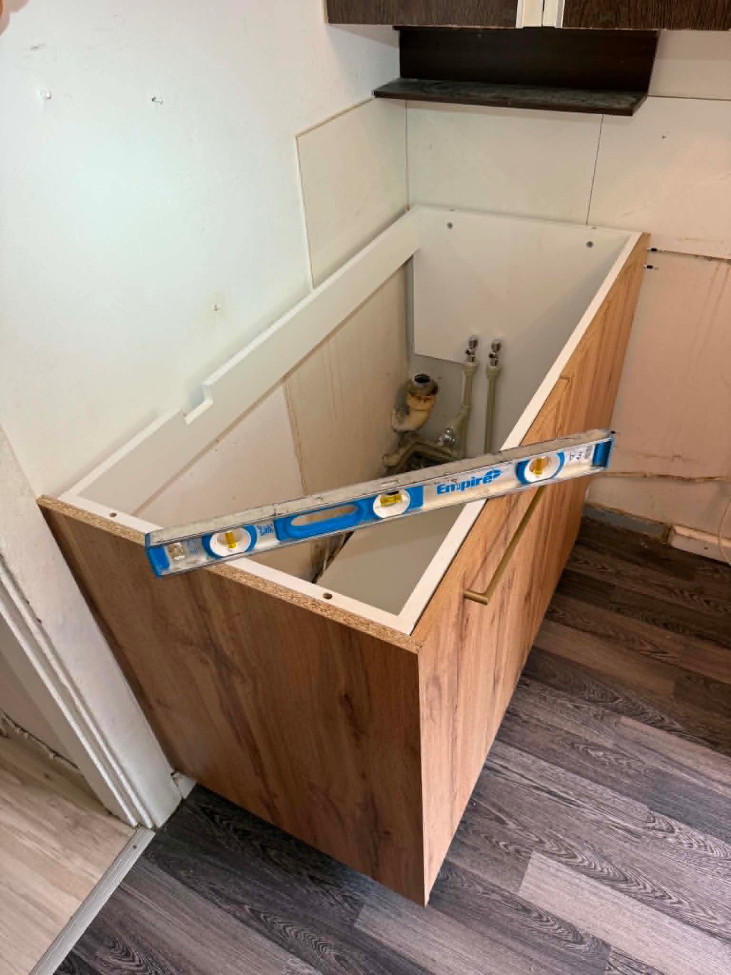 New cabinet fitted around water connections